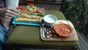 Porch Platter!!! Tomato, avo, carrots & celery with baguette & Chicken-in-a-Biscuit. Fruit & nut trail mix, home-made ranch sour cream, pepper-jack cheese, roasted red pepper hummus with sriracha